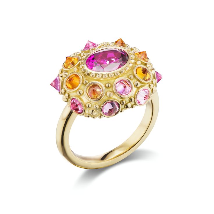 18k Yellow Gold, 1.43 Rhodalite Garnet, 1.50ct Pink Sapphires, and .90CT Orange Sapphires
My mother, Jackie O, and Sophia Loren influenced my jewelry aesthetic. All of them have an effortless style worn with incredible statement jewelry. I have emulated their vibe and wear my statement pieces with jeans and a white tee shirt. This aesthetic inspired the 'Pretty in Pink' Ring.

The delicate beauty of the sea urchin inspired its design with its inverted gemstones separated by gold beading. I chose Yellow Gold Multi-stone Ruby Ring, Multi-stone Ruby Ring In Yellow Gold, Unique Multi-stone Ruby Ring In Yellow Gold, Unique Yellow Gold Sapphire Ring With Accent Stones, Gold Multi-stone Pink Sapphire Ring, Luxury Yellow Gold Amethyst Ring With Rose Cut Diamonds, Gold Rings With Multi-stone Pink Sapphire, Wedding Yellow Gold Pink Sapphire Ring, Wedding Pink Sapphire Ring In Yellow Gold