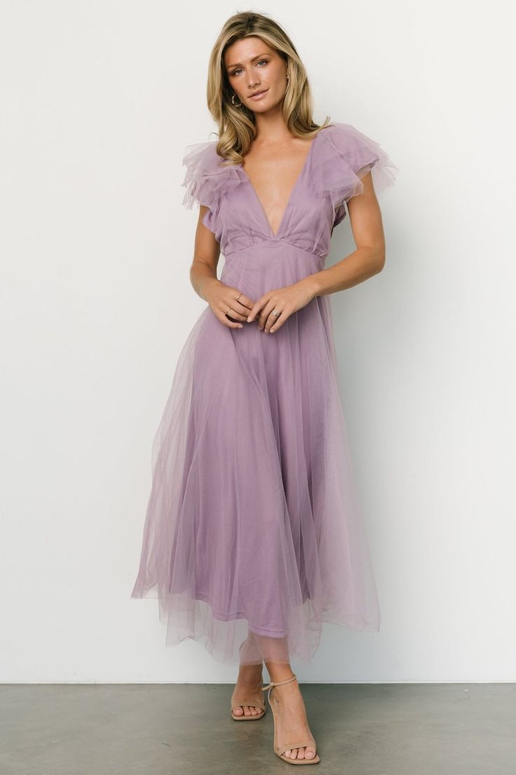 Wow the crowd with our new Annabella Tulle Dress. This dress will have you standing out in a crowd! Lavender V-neck Bridesmaid Dress, Purple Tulle Dress For Garden Party, Mauve V-neck Evening Dress, Evening Lavender Tulle Dress, Spring Lavender Tulle Dress, Feminine Tulle V-neck Dress, Lavender V-neck Evening Dress, Lavender Dress For Spring Wedding Guest, Mauve V-neck Dress For Wedding