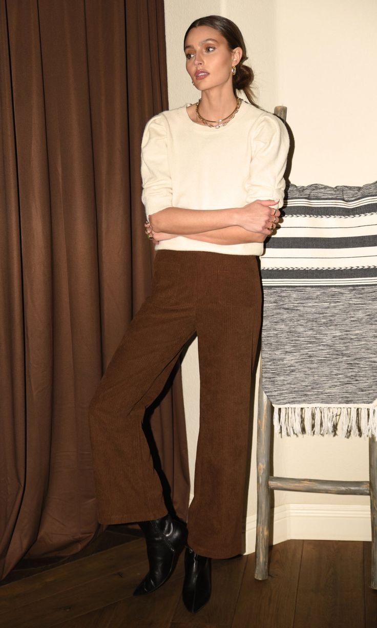 Designed for an effortless fit and comfortable feel. Constructed from a lightweight brown corduroy fabric with front pockets, these pants offer great style and convenience. Perfect for adding a classic touch to any wardrobe. Straight leg trousers Corduroy Inseam: 28 1/8" Front rise: 11 5/8" Waist: 13 3/4" Hips: 17" Self: 90% Polyester, 20% Rayon Hand wash cold. Dry flat. Low iron, or dry clean Model is wearing a size small Style #: G239P6378 Wide Leg Corduroy Pants Outfit, How To Style Brown Pants, New Era Outfit, Brown Flare Pants, Madewell Outfits, Corduroy Pants Outfit, Brown Flares, Straight Leg Pant, Comfortable Pants