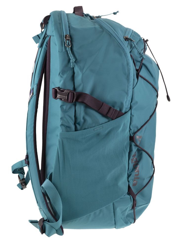 the back side of a backpack with straps on it and an external pocket for storage