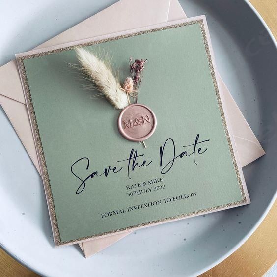 an elegant save the date card on a plate