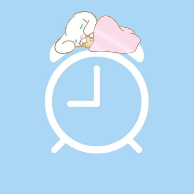 a clock with a baby sleeping on it's side next to a pink heart