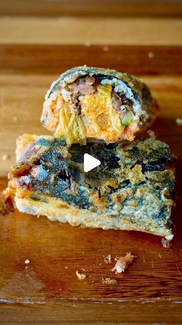 two pieces of food sitting on top of a wooden cutting board next to each other