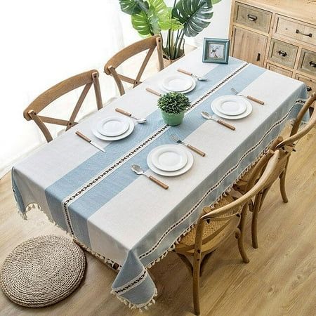 a dining room table with plates and place settings