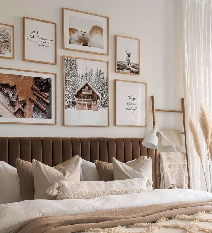 a bedroom with pictures on the wall above the bed