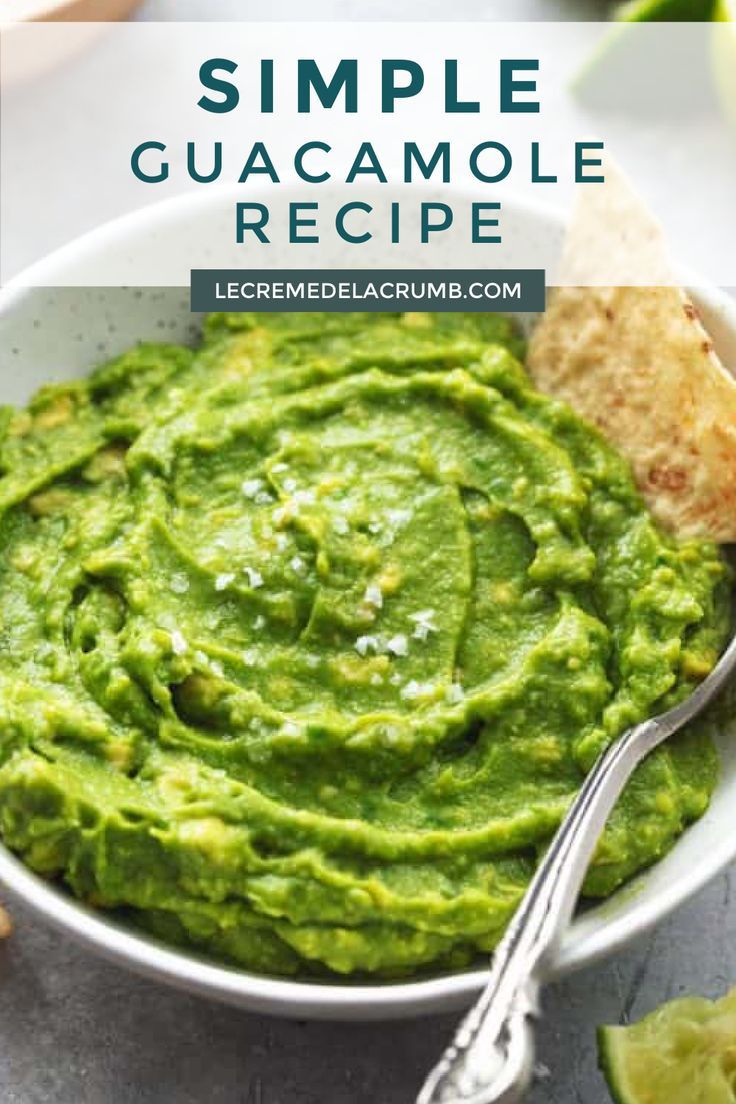 a white bowl filled with guacamole and tortilla chips on the side