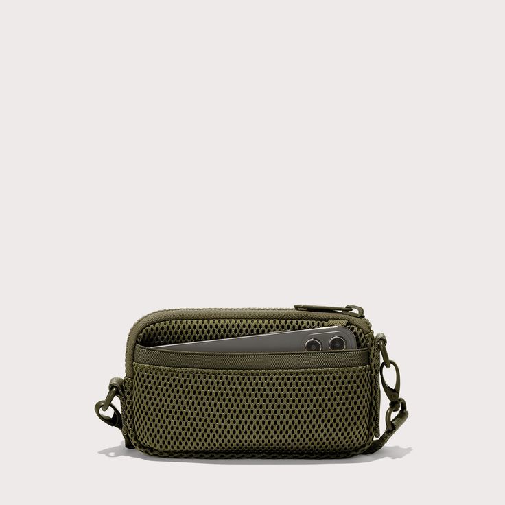 Breathable. Cushiony. Durable. Our lightweight crossbody bag for travel has you covered. Designed for daily adventures and travel too, this dark green Air Mesh sling bag keeps essentials within reach without weighing you down. Drape it across your chest, on your shoulder, or around your neck for the ultimate way to float through your day. Features interior and exterior pockets, an elastic loop, card slots, and a secure zipper closure, it keeps your stuff safe and organized anywhere. Green Portable Shoulder Bag For Outdoor, Versatile Green Portable Shoulder Bag, Versatile Outdoor Rectangular Travel Accessories, Green Durable Shoulder Bag For Outdoor, Durable Green Shoulder Bag For Outdoor, Durable Everyday Pouch Bag, Outdoor Durable Green Shoulder Bag, Versatile Green Shoulder Bag For Outdoor, Casual Portable Shoulder Bag For Everyday Carry