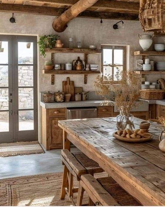 a rustic looking kitchen with wooden tables and chairs