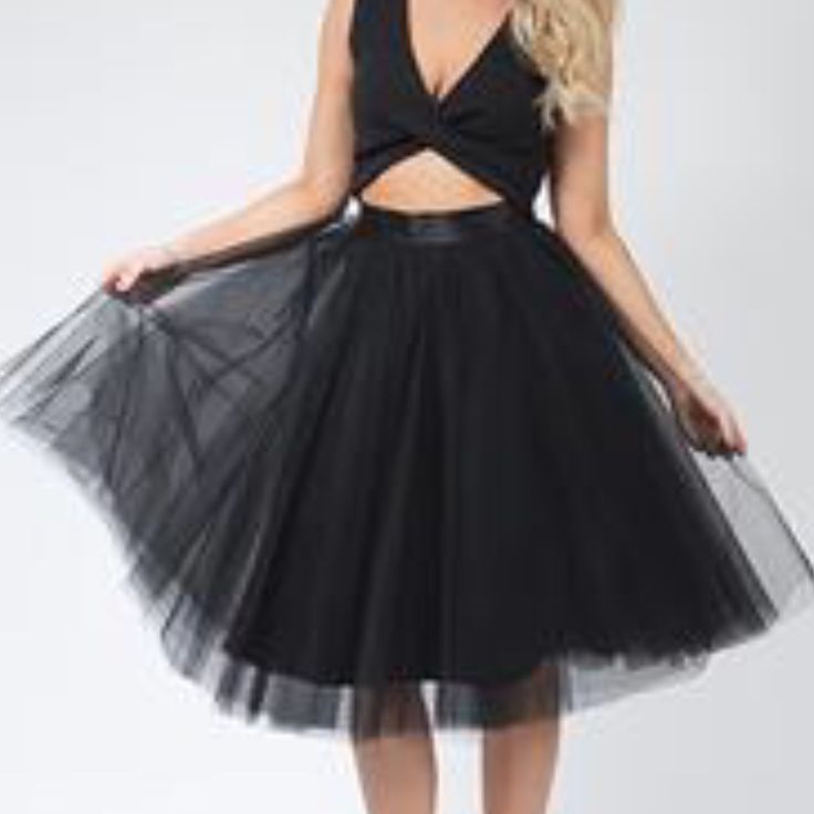 Black Tulle Skirt This Is An Upscale Version Of The Ordinary Tulle Skirt *Satin Waist Band (No Stretch) As Ordinary Usually Has An Elastic Waist Band * 5 Layers Of Tulle (Not See Through) Great Material No Stretch At Waist Invisible Back Zipper Can Be Styled Up Or Down. Wear With A Tee Or Nice White Button Down! So Many Ways To Wear This Cute Skirt! *Both Models Are Wearing A Small Flirty Evening Skirt For Spring, Elegant Black Petticoat For Party, Elegant Black Party Petticoat, Flirty Pleated Skirt For Party, Flirty Flared Mini Skirt For Party, Chic Tulle Petticoat, Pleated Midi Skirt Party Dress, Black Mini Skirt For Summer Cocktail, Chic Party Tulle Skirt