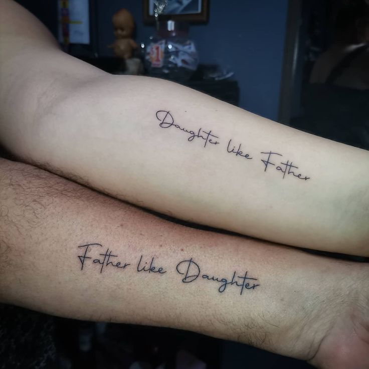 two people with tattoos on their arms that say, daughter like father and father like daughter