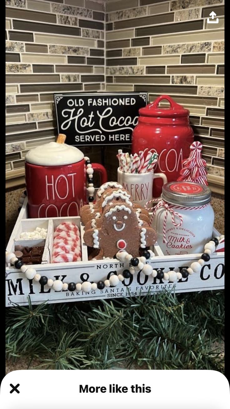 an old fashioned hot cocoa serving tray is decorated with gingerbread cookies, marshmallows and candy canes