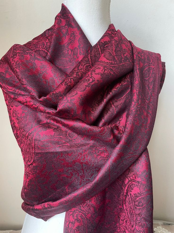 Introducing our luxurious silk pashmina scarf, the ultimate accessory to elevate any outfit. Made with a blend of premium silk and pashmina, this scarf is incredibly soft and lightweight, yet warm and cozy. Size : 180 cm * 72 cm Crafted by skilled artisans, this scarf features a beautiful woven pattern that adds a touch of elegance and sophistication to your look. The natural sheen of the silk and the plush texture of the pashmina create a stunning visual effect that is sure to turn heads. This Elegant Red Winter Shawl, Red Silk Pashmina Shawl, Luxury Formal Pashmina Shawl, Elegant Silk Shawl For Winter, Classic Red Silk Scarf, Formal Elegant Pashmina Shawl, Elegant Red Pashmina Scarf, Elegant Red Scarves For Winter, Elegant Red Scarf For Winter