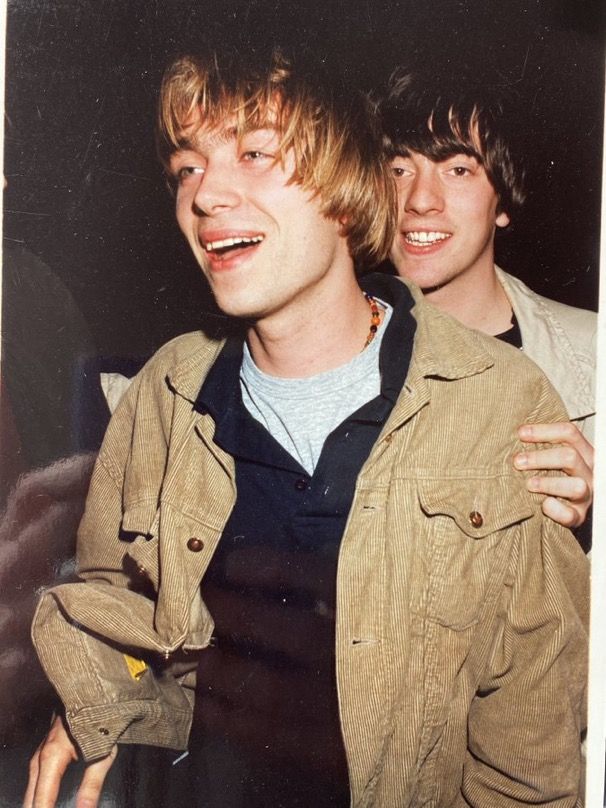 two young men standing next to each other