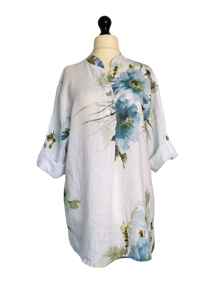 . Made from 100% linen in a pretty floral pattern , loose fitting tunic shirt style with short roll tab sleeves, button fastenings on the front neck and a single pleat detail on the bust . One size - to fit UK sizes 14 16 18 . Bust measures : 46 inches . Length from back of neck to bottom hem : 32 inches . Brand new with tags . Visit our shop for lots more gorgeous quirky lagenlook fashion !! Casual Floral Print Short Sleeve Tunic, Vacation Linen Blouse With Floral Print, Spring Linen Blouse With Floral Print, Linen Floral Print Blouse For Daywear, Daywear Linen Blouse With Floral Print, Linen Blouse With Floral Print For Daywear, Spring Linen Tunic With Buttons, Summer Floral Print Shirt With 3/4 Sleeves, Spring Linen Blouse With Rolled Sleeves