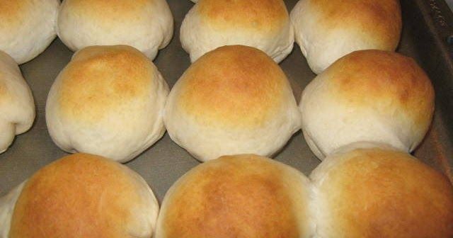 freshly baked rolls in a baking pan ready to go into the oven