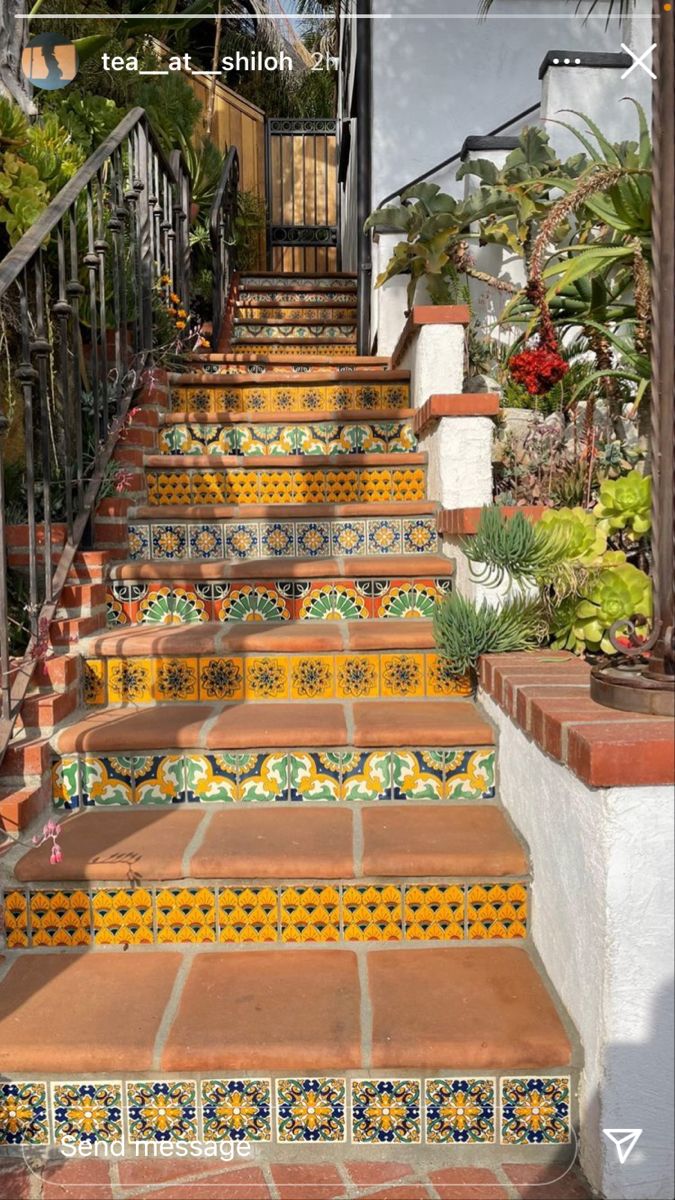 the stairs are decorated with colorful tiles