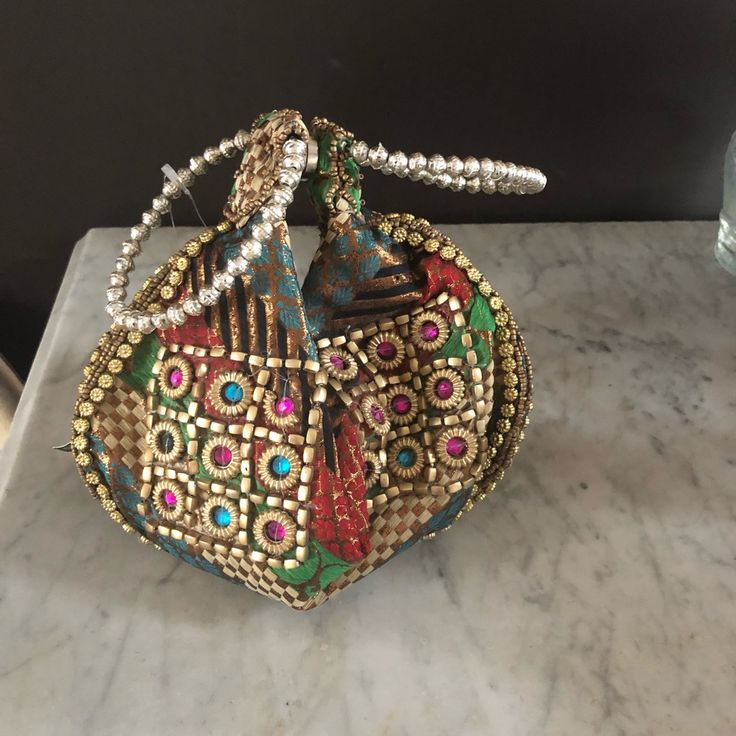 Indian Wristlet Evening Handbag. Silver Beaded Handles Multicolored With Gold Beading. Zips Open. Inside Of The Purse Is Lined. Measures 10” X 6 1/2 Inches Open. Festive Multicolor Handheld Bag, Festive Multicolor Handheld Bags, Festive Multicolor Pouch Evening Bag, Multicolor Clutch With Detachable Handle, Multicolor Handheld Evening Bag As Gift, Multicolor Handheld Evening Bag For Gift, Silver Clutch For Festivals, Multicolor Evening Bags For Festivals, Silver Clutch For Festivals And Gifts