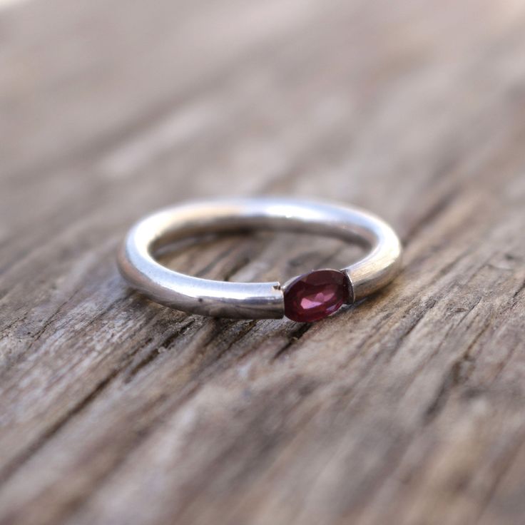 Faceted Garnet Sterling Ring Faceted red oval shaped garnet set in sterling silver ring . stone approx. 30mmx25mm Oval shaped Natural Garnet Size 7 Oval Garnet Rings As Gift, Oval Garnet Ruby Ring As Gift, Oval Sterling Silver Ruby Promise Ring, Oval Garnet Ring For Gift, Red Oval Stackable Promise Rings, Oval Cabochon Garnet Rings For Anniversary, Oval Ruby Gemstone Stackable Rings, Oval Silver Ruby Promise Ring, Oval Silver Garnet Birthstone Ring