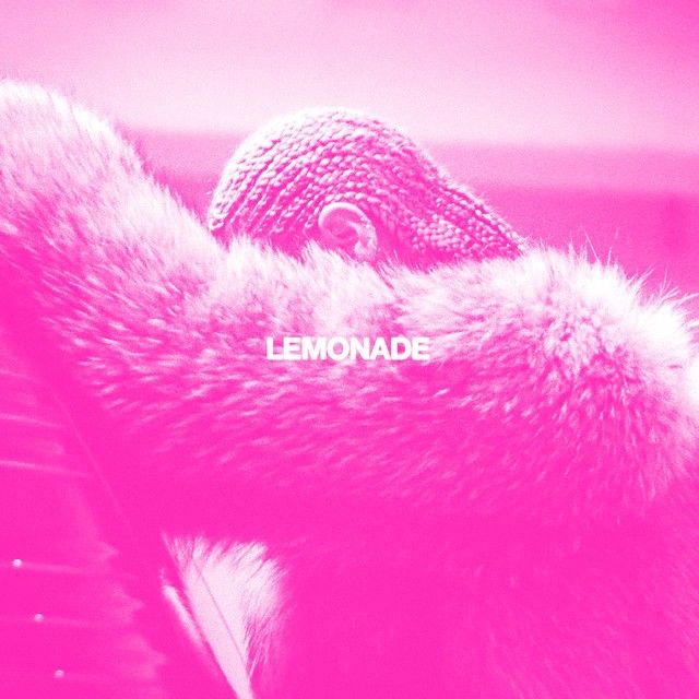 the word lemonade is written on top of a fur coat over an open laptop keyboard