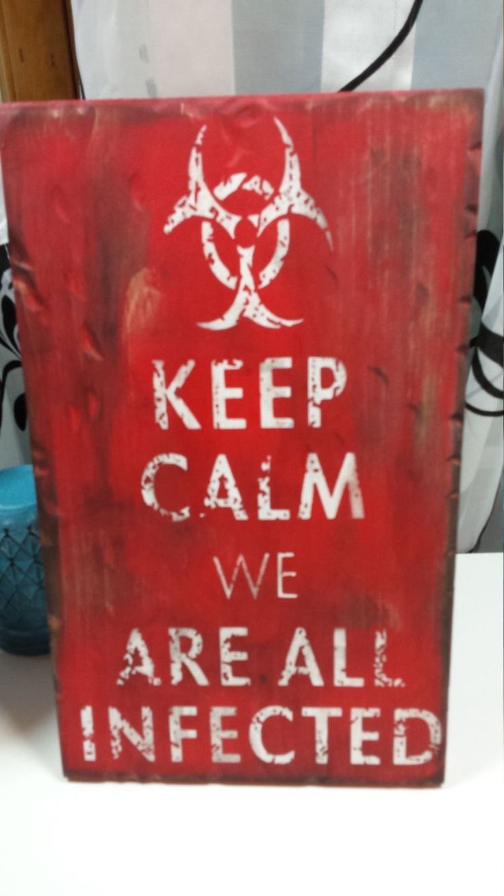 a red sign that says keep calm we are all infected