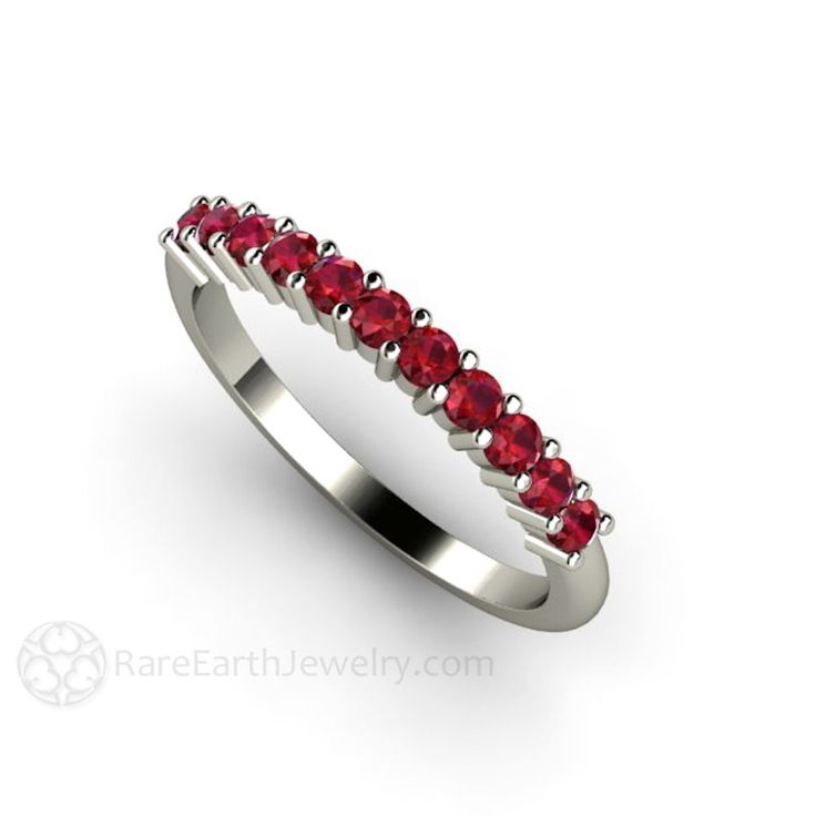 A gorgeous Ruby band in your choice of 14K or 18K White, Yellow or Rose Gold and Platinum. Ruby is the birthstone for July. This ring features the finest quality Lab grown Ruby in the world. It's physically, chemically and optically identical to a natural Ruby, it's just grown in a lab setting. Prefer a natural Ruby? Ask for pricing. This ring can be worn singly, as a fashion ring, wedding ring or anniversary band, or stacked with others for a stunning and unique look. Made to order. Please allo Elegant Stackable Ruby Ring For Wedding, Elegant Stackable Ruby Wedding Ring, Classic Ruby Eternity Band For Wedding, Anniversary White Gold Ruby Ring With Halo, Ruby Ring With Prong Setting For Anniversary, Ruby Half Eternity Ring For Anniversary, Anniversary Ruby Ring With Half Eternity Band, White Gold Ruby Ring With Halo For Wedding, Fine Jewelry Ruby Half Eternity Ring For Anniversary