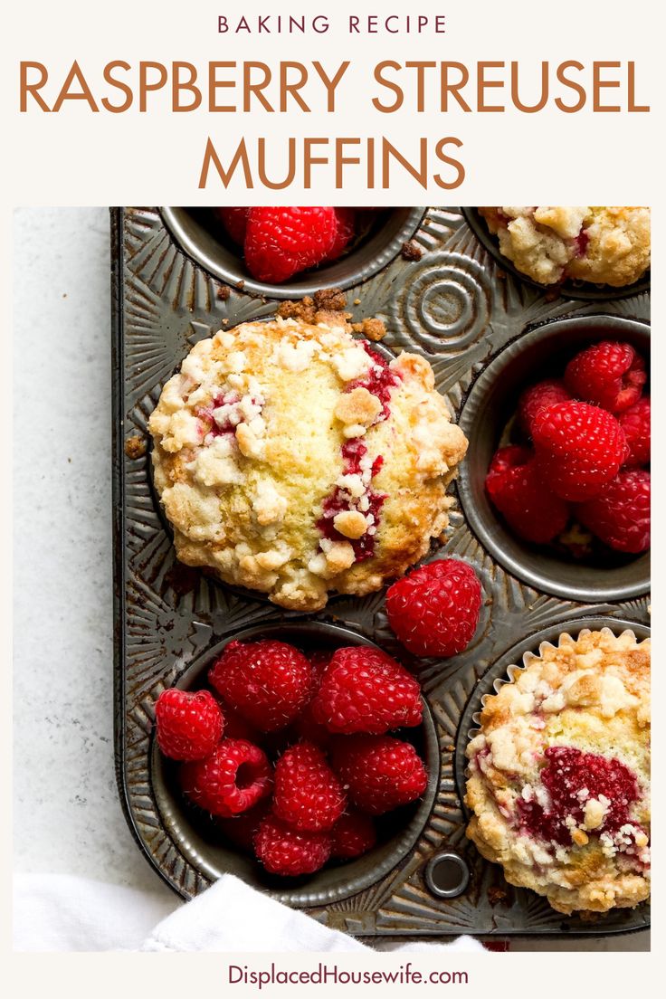 raspberry streusel muffins in a muffin tin with fresh raspberries