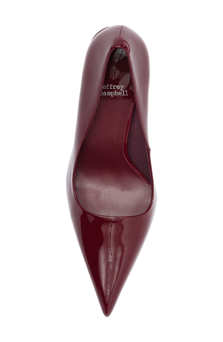 An architectural heel adds scene-stealing height to a glossy pointed designed with a pointy toe for modern allure. 4" heel Synthetic upper/leather and synthetic lining/synthetic sole Imported Red Fitted Slingback Pumps With Pointed Toe, Red Glossy Pointed Toe Heels, Sleek Red Heels For Work, Sleek Pointed Toe Court Shoes With Red Sole, Sleek Court Shoes With Red Sole And Pointed Toe, Glossy High Heel Workwear Heels, Sleek Heels With Red Sole And Pointed Toe, Patent Leather Heels With Red Sole And Pointed Toe, Sleek Red Pointed Toe Heels