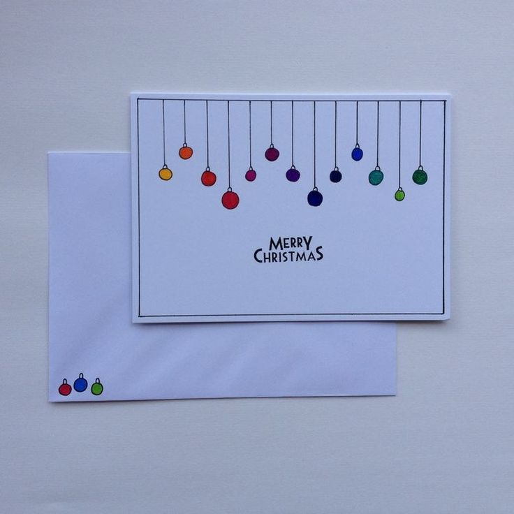 a christmas card with colorful ornaments hanging from it's side on a white background