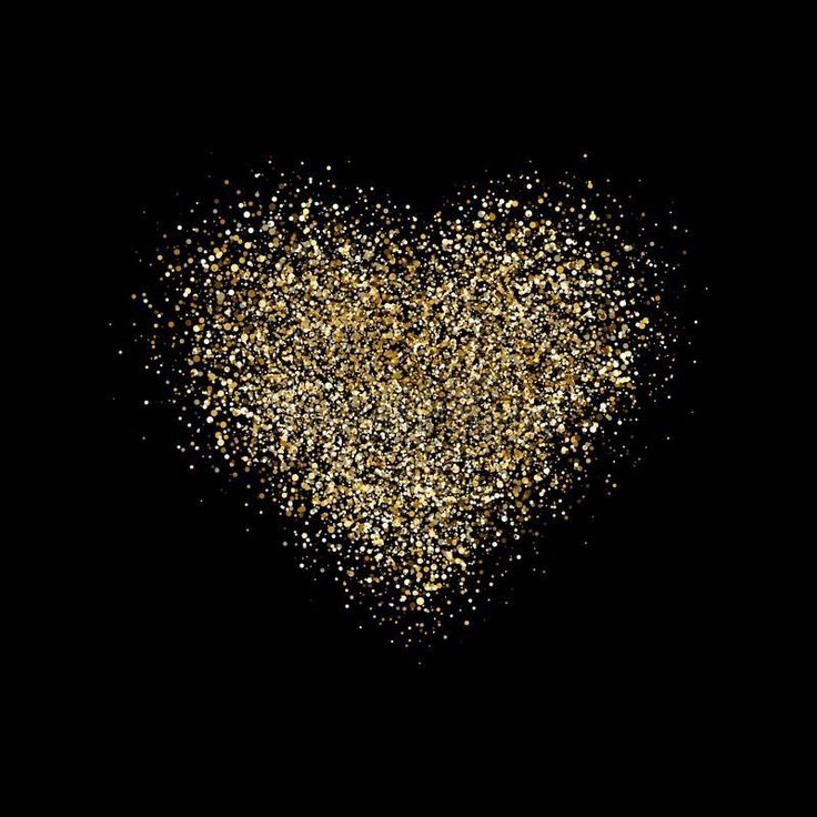 gold glitter heart on black background