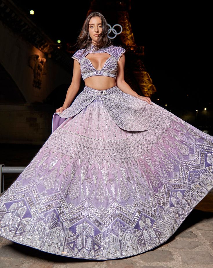 Purple Ombre Lehenga Set, a blend of elegance and artistry. Handcrafted with intricate hand embroidery, the linen satin lehenga radiates grace. Paired with a matching blouse and complemented by an ethereal organza dupattaFrom Jigar Nikita’s 11:11 In Paris collection DELIVERY TIMEPlease allow 8-12 weeks for your outfit to arrive. FABRIC DETAILSLehenga - Linen Silk, Blouse - Net & Linen Silk, Dupatta - Net Professional cleaning only. Designer Lehenga With Resham Embroidery For Wedding, Designer Lehenga With Resham Embroidery, Designer Resham Embroidery Lehenga, Elegant Hand Embellished Purple Sets, Silk Designer Lehenga, Designer Silk Lehenga, Designer Lehenga With Intricate Embroidery And Traditional Drape, Designer Choli With Intricate Embroidery For Wedding, Designer Sets With Intricate Embroidery For Reception