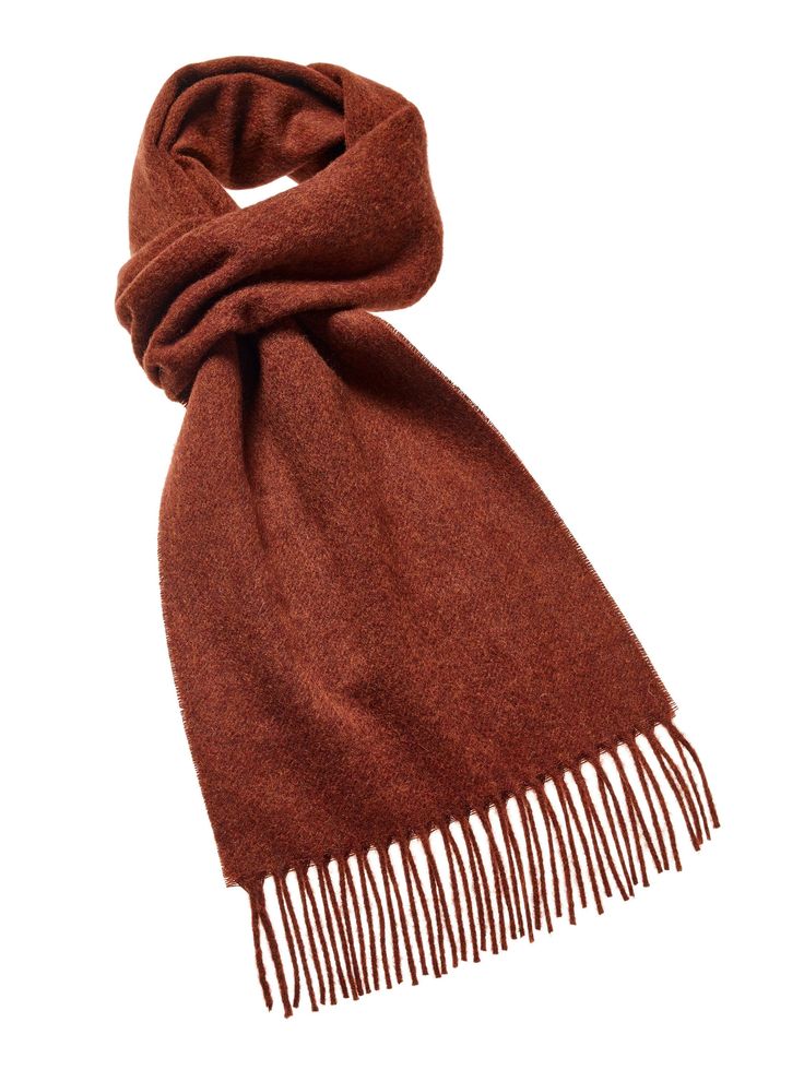 "The ultimate fashion statement, the Plain Luxury Scarf is the perfect accessory to compliment or enhance an Autumn, Winter or Spring outfit. A soft, warm and elegant scarf made from 100% Pure Merino Lambswool. Our Plain Luxury Scarves are available in a wide variety of colors which can either contrast or match your outfits. Seen here in Plain Rust Approx size incl. fringe 10\" x 75\" (w x l) This product is manufactured by Abraham Moon & Sons Ltd who have been producing quality wool product Elegant Luxury Merino Wool Scarves, Luxury Elegant Merino Wool Scarves, Rust Colored Shawl, Luxury Fringe Scarves For Fall, Casual Brown Scarves, Luxury Brown Bohemian Scarf, Luxury Brown Pashmina Scarf, Luxury Brown Elegant Scarves, Luxury Brown Scarves For Women