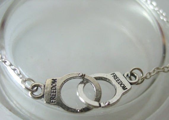 "This is a nice bracelet to add to your wrist it has a small silver cuff with the word \"Freedom\" engraved on it. These will make great friendship bracelets!" Metal Name Bracelet For Friendship, Silver Metal Friendship Bracelets, Silver Metal Promise Bracelets, Silver Metal Bracelets For Promise, Silver Metal Promise Bracelet, Silver Promise Bracelet, Silver Promise Bracelet With Adjustable Chain, Hand Stamped Silver Metal Bracelets, Nickel Free Metal Name Bracelet In Silver