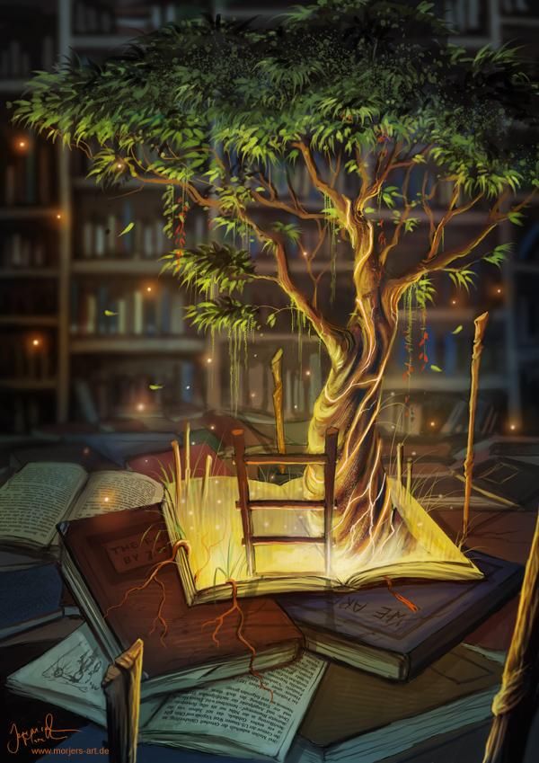 an open book sitting on top of a pile of books next to a lit up tree