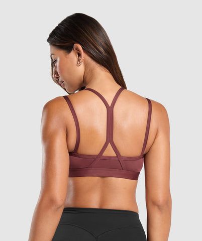 FIND THE ONE Finding the one can be hard. But our sports bras are more trustworthy, supportive & reliable than your ex. • Cute double strap feature• Removable padding lets you to wear it how you want• Light V-neck• Stay-put elasticated underband SIZE & FIT• Body fit • Medium support • Model is 5'8" and wears size XS MATERIALS & CARE• 78% Recycled Polyester, 22% Elastane SKU: B8A6A-RBQV Breathable Strappy Sports Bra, Supportive Strappy Sporty Activewear, Supportive Strapped Sporty Activewear, Breathable Strappy Back Sports Bra, Breathable Strappy Sports Bra For Gym, Breathable Sports Bra With Strappy Back, Breathable Functional Sports Bra With Strappy Back, Nylon Sports Bra With Straps For Gym, Strappy Nylon Sports Bra For Gym