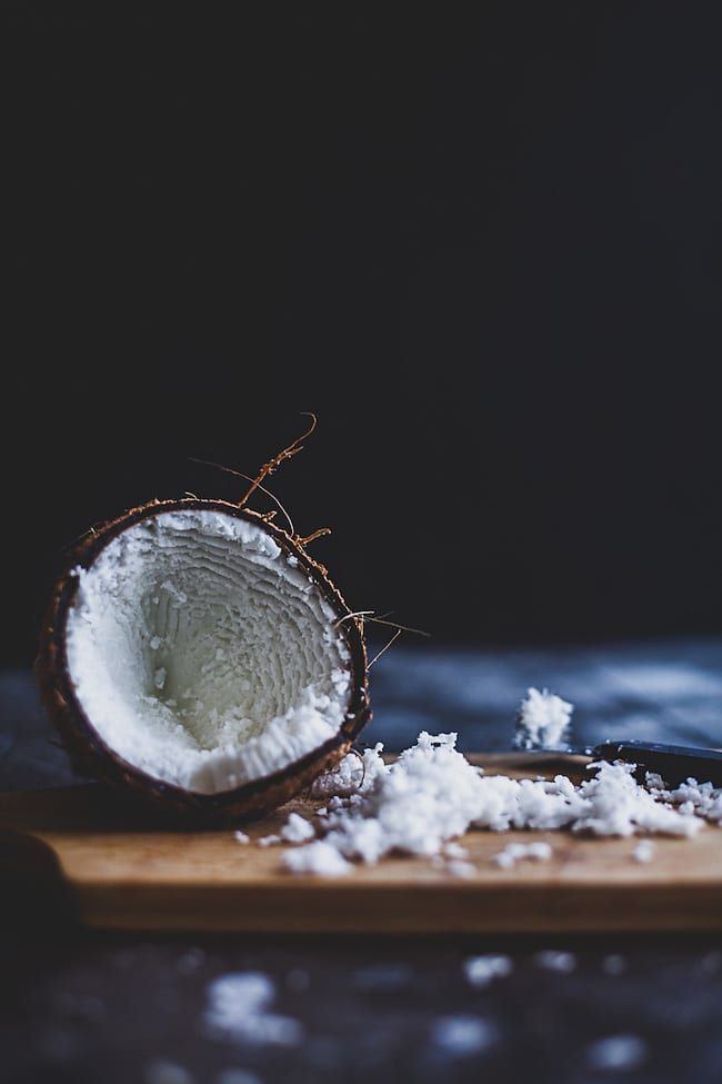 coconuts and sea salt on a cutting board