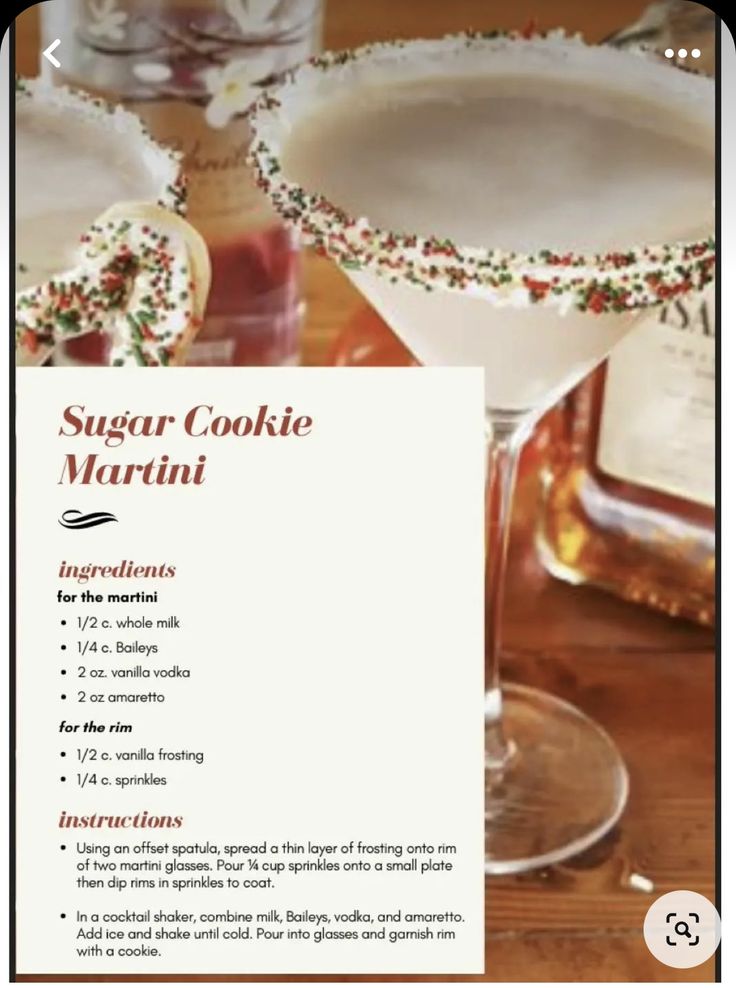 a recipe for sugar cookie martinis on a wooden table with two glasses filled with drinks