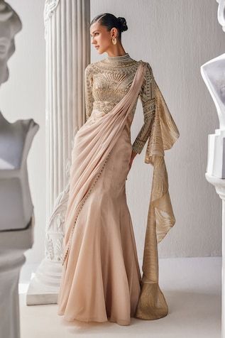 Golden cream pre-draped saree gown in shimmer chiffon base with a zardozi embroidered yoke and high neckline. - Aza Fashions Floral Work Blouse, Draped Saree Gown, Saree Gowns, Draped Saree, Cotton Saree Designs, High Fashion Dresses, Gown For Women, Saree Gown, Saree Blouse Patterns