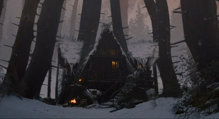 the cabin in the woods is lit up at night