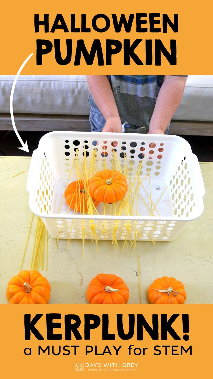 a white basket filled with pumpkins sitting on top of a table