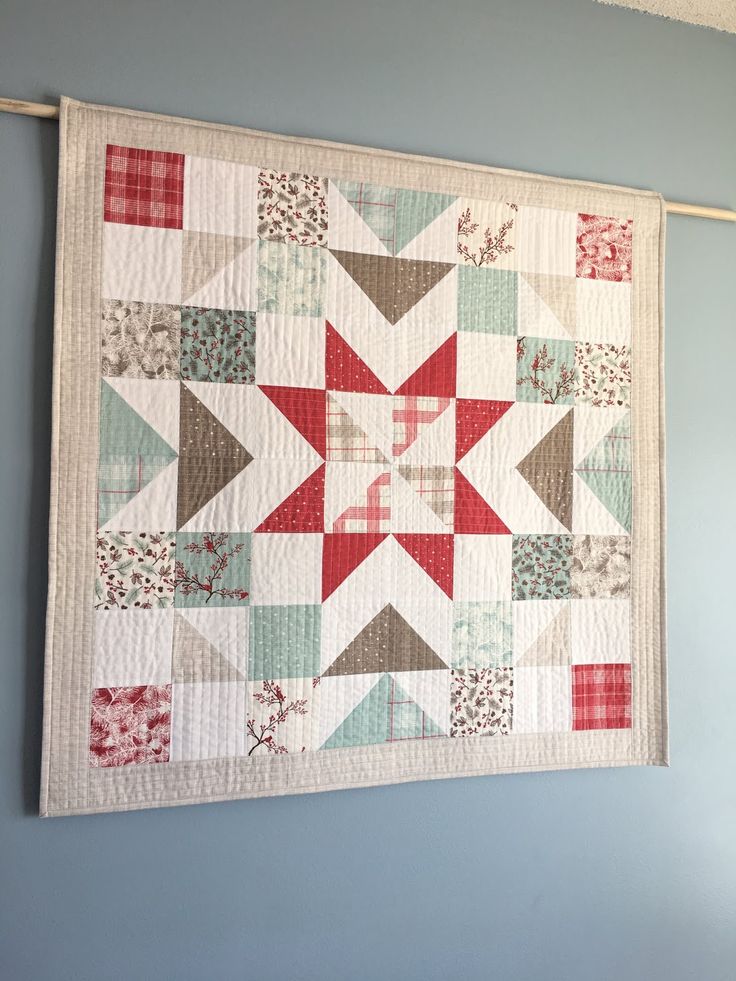 a quilt hanging on the wall