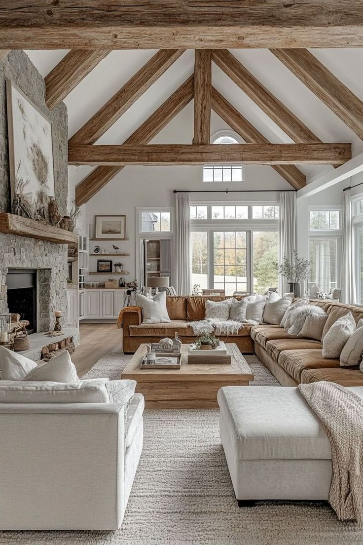 a living room filled with furniture and a fire place in the middle of a room