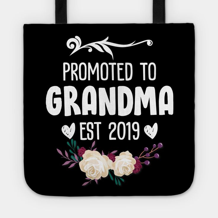 a black tote bag with white roses and the words, promote to grandma est 2019