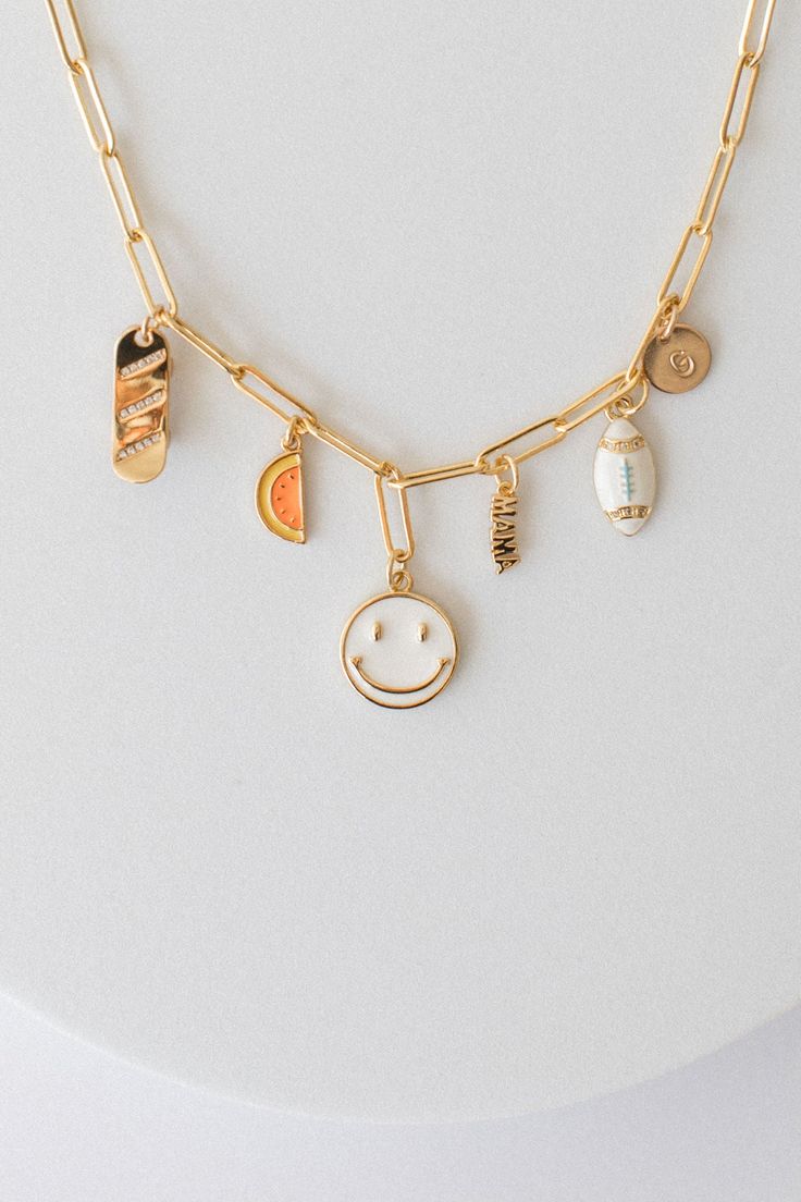 Build your own charm bracelet, necklace or earrings and tell your story with charms! Pick and choose the charms that mean the most to you and create your very own custom charm bracelet, necklace and earrings. BYO Charm Bracelet Bundle Here! BYO Charm Necklace Bundle Here! BYO Charm Earrings Bundle Here! - Smiley Face Charm with Enamel Accents - Crafted with 14K Gold Filled Chain and Charms. - Handmade with love from San Clemente, CA. - 15mm x 15mm Trendy Cheap Everyday Charms, Cheap Trendy Dangle Charm Bracelet, Cheap Trendy Jewelry With Removable Charms, Affordable Everyday Charm Bracelet With Chain, Cheap Everyday Dangling Charms, Trendy Everyday Cheap Charms, Cheap Cute Charms Jewelry, Cheap Dangle Charms Jewelry, Cheap Trendy Alloy Charm Bracelet