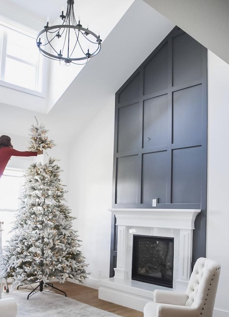 a living room filled with furniture and a christmas tree