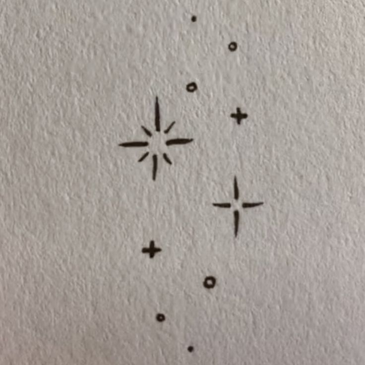 some black and white ink on paper with stars in the middle, one star has been drawn