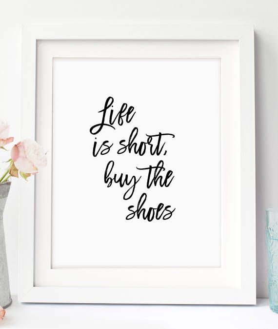 a white framed print with the words life is short buy the shoes