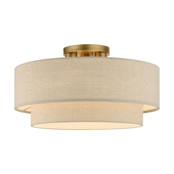 a light fixture with a beige shade on it