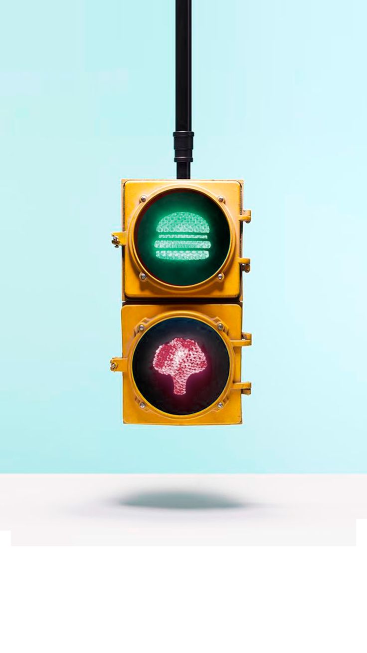 a traffic light that is green and has the word stop written on it in red