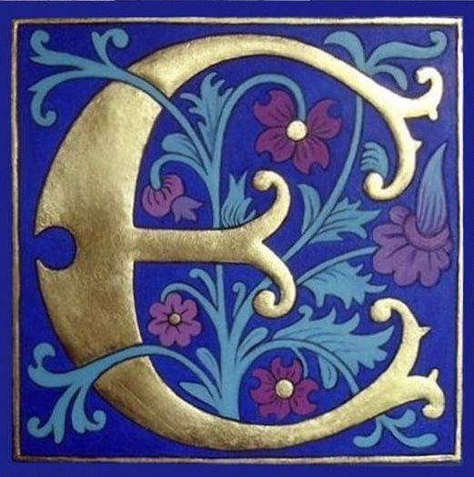 the letter e is painted in gold and blue with flowers on it's sides