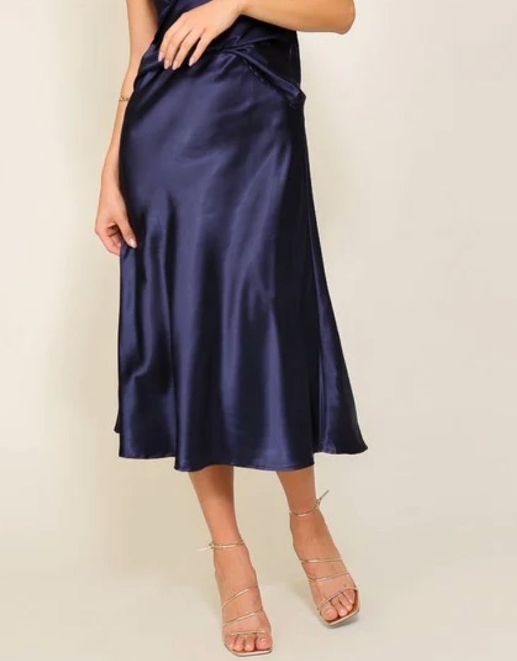 This luxuriously elegant skirt, with a silhouette that gently cascades down to a flirtatious, mid-calf length. Its wondrous blend of lustrous satin and a cinched elastic high waistband offers an enchanting flair that's both flattering and comfortable. A true masterpiece that will leave onlookers in awe with its mesmerizing flow and refined style. This is the flare midi satin skirt that you have been longing for, perfect for any occasion that calls for sophistication and class.PRODUCT SPECIFICATIONS*Fabric Contents: 97% Polyester, 3% Spandex*Care Instructions: Machine wash cold, gentle cycle, tumble dry low.*Brand: Timing*Model is wearing a size SmallMEASUREMENT (inches)*S: 13.0 (Waist), 29.5 (Length)*M: 13.5 (Waist), 30.0 (Length)*L: 14.0 (Waist), 30.5 (Length) Midi Satin Skirt, Midi Flare Skirt, Elegant Skirt, Refined Style, Satin Skirt, Flare Skirt, Mid Calf, Care Instructions, Satin